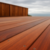Freshly installed ipe hardwood decking boards with stainless steel fasteners on a Bay Area outdoor deck under an overcast sky.